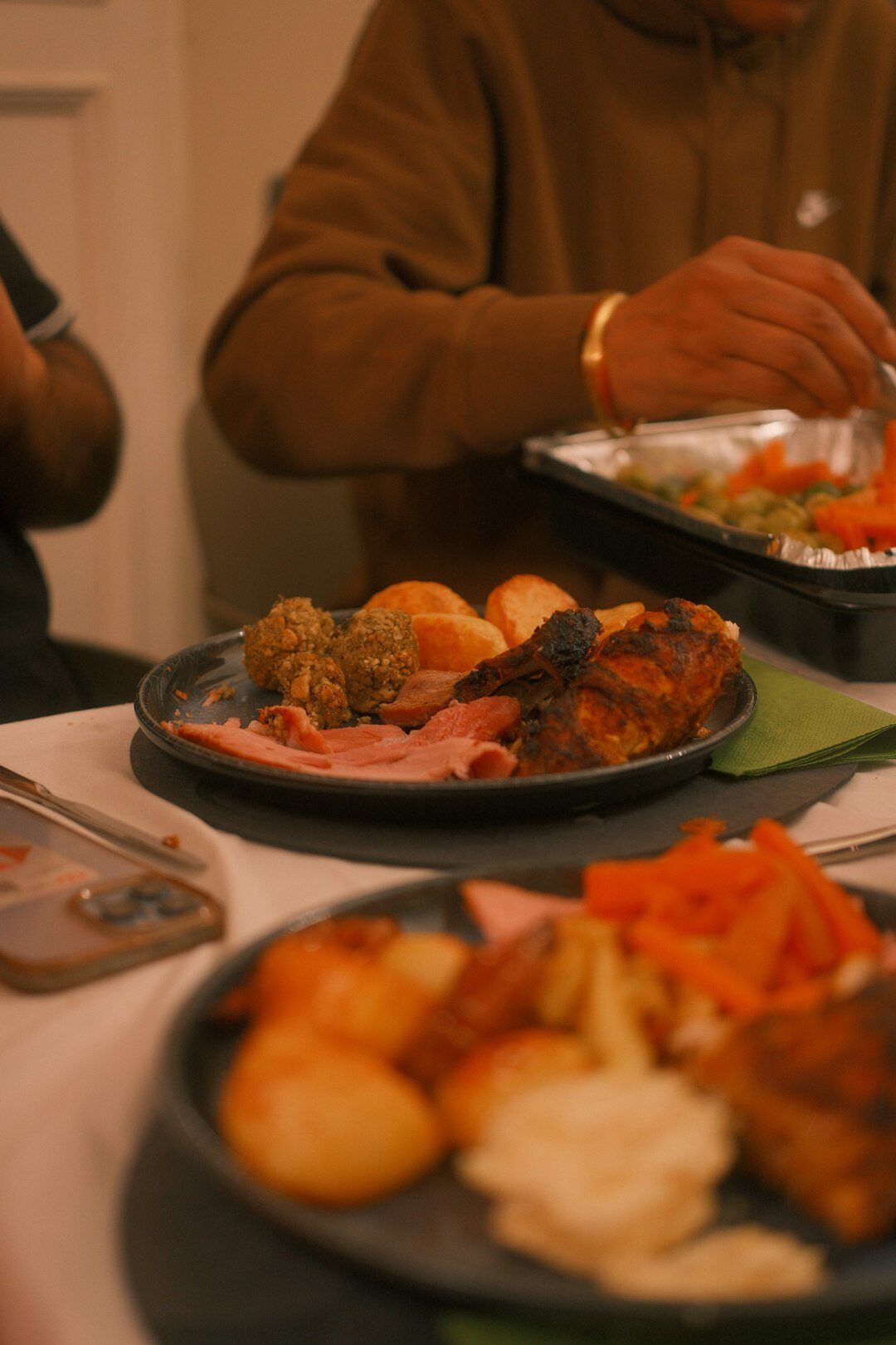 Czech family eating dinner together at a wooden table